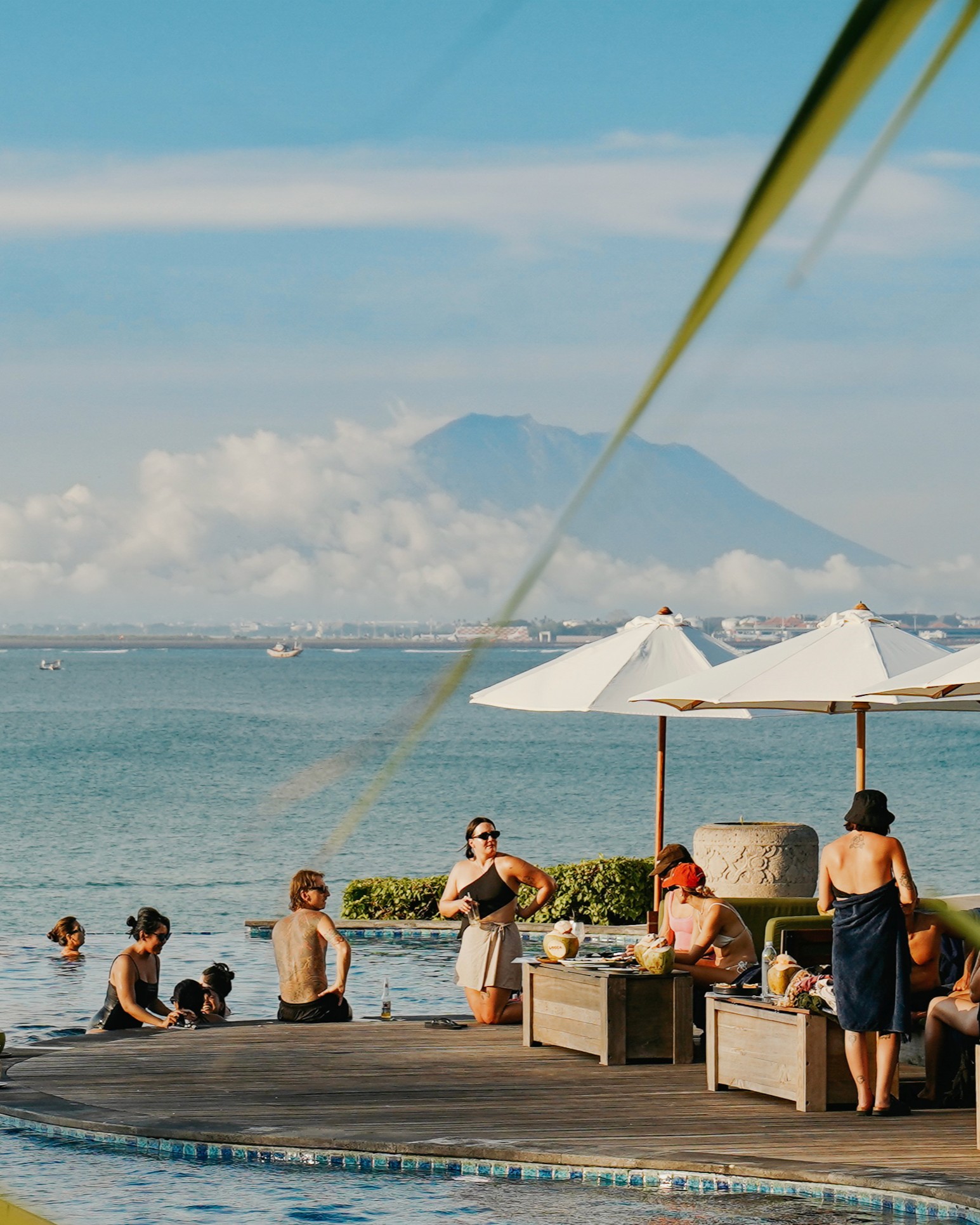 Locca Sea House pool deck with Mount Agung and the Jimbaran sea