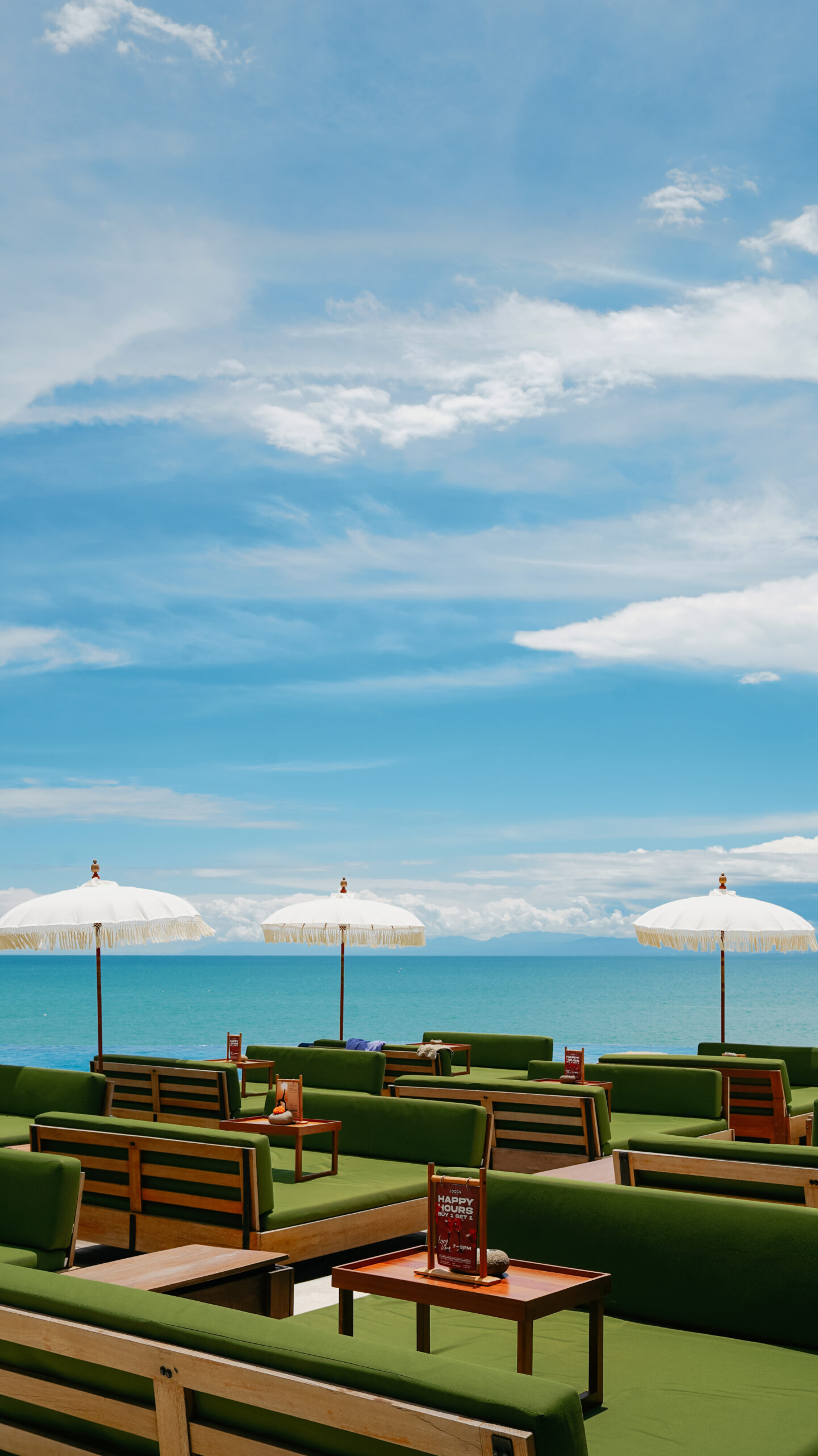 Sea-view terrace and daybeds at Locca Sea House